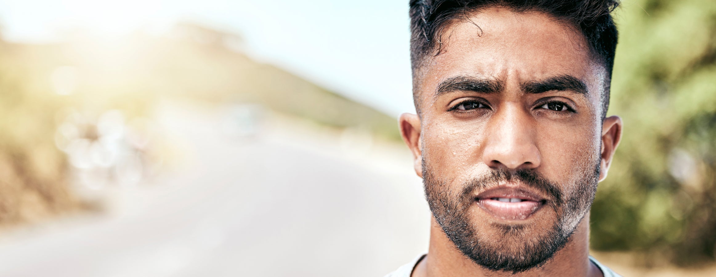 A worried looking man staring into the camera