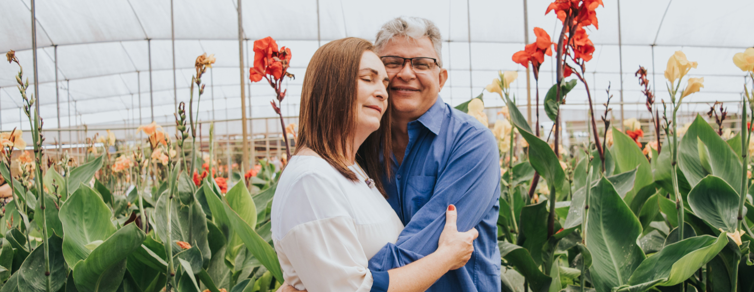 A couple embracing among flowers