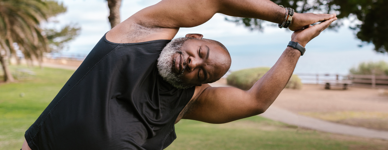 A man doing stretching exercises outside