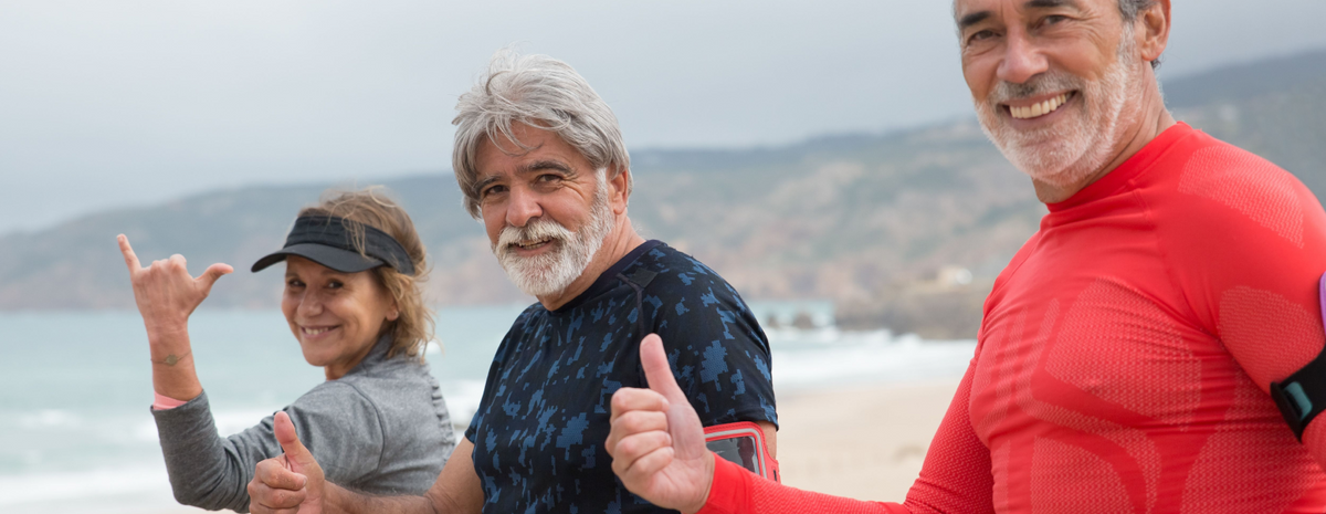 Three people after a jog giving a thumbs up 