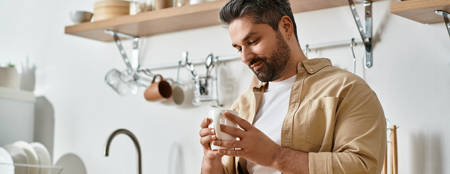 An image of a man standing in a kitchen
