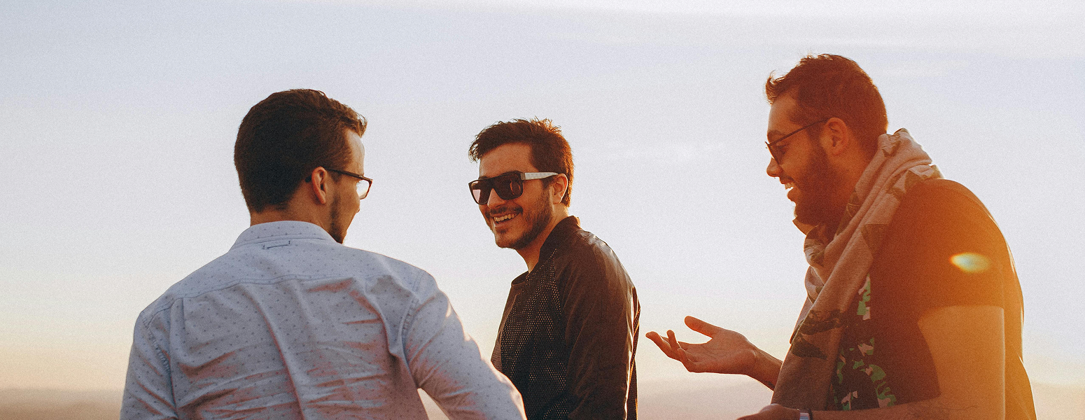 three men chatting 