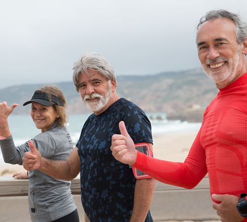 Three people smiling before going for a run